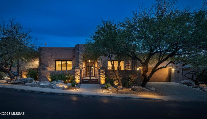 Set on a private golf course lot in Ventana Canyon, this meticulously updated masonry block home features 5 bedrooms and 4 bathrooms + an office/den, and a 2 car garage with separate golf cart garage. Enter this sophisticated residence through a gated private courtyard and into the lofty foyer entryway. The entrance flows into a formal dining room, featuring floor to ceiling sliding glass doors that open to a private patio area. The updated kitchen offers crisp white quartz countertops, a pro-level stainless steel appliance package, built-in Wolf coffee system, wine fridge, and warm Maple cabinetry. Stunning 24'' X 24'' travertine tile flows through the home, with plush carpet in the bedrooms, and solid Maple doors. The primary suite is located on the first floor, complete with private patio access, and a spa-like bathroom with a freestanding tub and separate rain shower. An additional 2 bedrooms are located on the primary level, each being a generously sized light-filled room. The second floor offers 2 more guest bedrooms, a beautiful bathroom with dual vanities and walk-in shower, and a private balcony with exterior spiral staircase, offering sensational mountain and golf course views. 

Meticulously incorporated updates to the home include: newer windows and doors, motorized Hunter Douglas shades, a 72" Mezzo linear fireplace, carpet, paint, baseboards, lighting, security system, and thoughtfully placed landscape lighting. 

Seamless indoor-outdoor entertaining connects the shared living spaces, with a series of doors coordinated to tie the interior rooms to the spacious outdoor living environments. Walkways meander through the lush grounds, leading to a stone fireplace with sitting area; the result being a home that offers a sense of ease to enjoy the Arizona lifestyle.

Ultra-privacy meets convenient proximity to all of life's necessities. Just moments away from hiking and biking trails, shops and restaurants, as well as the exclusive Ventana Country Club, offering 36-holes of championship golf, an elite tennis program, a resort and a lap swimming pool, and features a members clubhouse with dining and lodging for member's guests.
