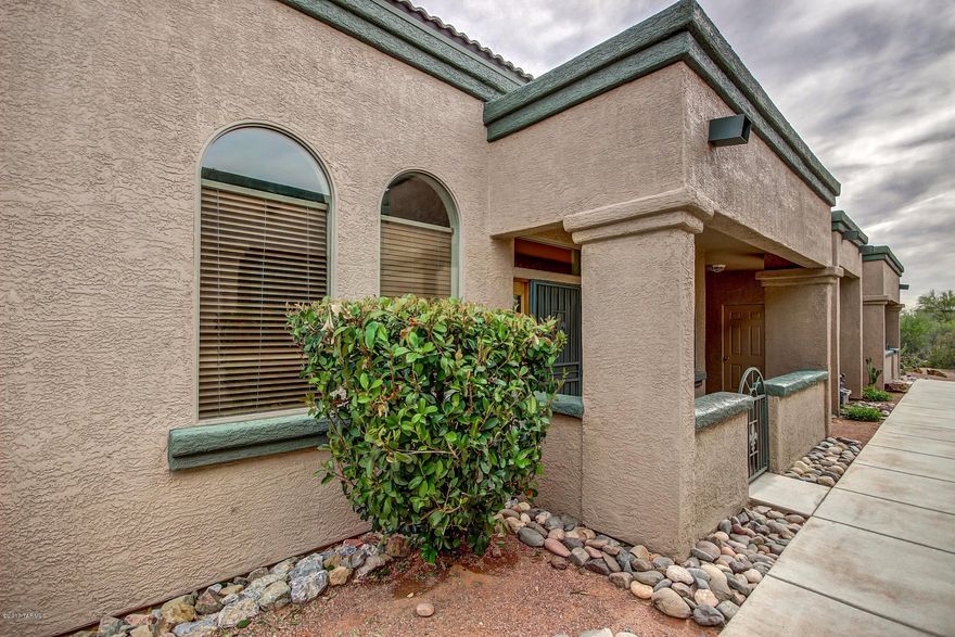 Range Price $123,000-$129,000. Charming 2 bed 2 bath + Den home in the Kinney Village community of Tucson! This move in ready home offers an open floor plan with new custom paint tones and new tile flooring throughout.  Both bedrooms have patio doors.  The floor plan has the doorway to the den down the hall - plenty of room for TV on two living area walls.  Upgraded kitchen features honey oak cabinets, stainless steel appliances, ample counter space, and a breakfast bar. View of mountains.  Refreshing blue pool and community amenities are just a short distance away! This home is ready for your personal touches!