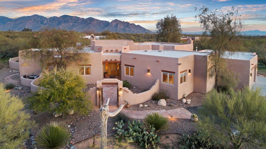 Custom built 5 bedroom home, beautifully maintained on a 3.3 acre estate with stunning mountain views. Inviting large Pella Windows, cedar doors, tongue and groove beamed ceilings, vigas and concrete floors reflect an exquisite Southwestern style. The kitchen exudes quality, with Viking Prof. Series stainless steel appliances and custom tile counter tops throughout. Split floor plan boasts walk in closets and built ins in all bedrooms. Master suite has French Doors to patio, sitting area with fire place, huge bathroom complete with spa bath, walk in shower and quaint separate vanity areas. Outdoor living with sparkling pool and covered patio with fireplace. Bring your horses!!! Horse property cleared and shade structure large enough for 3 stalls in place.