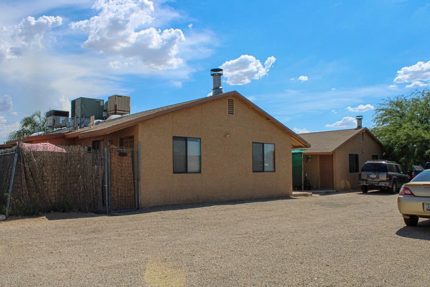 GREAT INVESTMENT/CENTAL LOCATION. Occupied spacious 3/2, heat pump, fireplace, each unit has outside laundry room/storage, fenced backyard & covered patio.  Plenty of off street parking, tenants pay untilites. Well maintained in great condition. Sale must include adjacent 1245/1255 mls # 21920151.  Close to downtown, U of A, shopping and restaurants. Call agent for showing instructions.