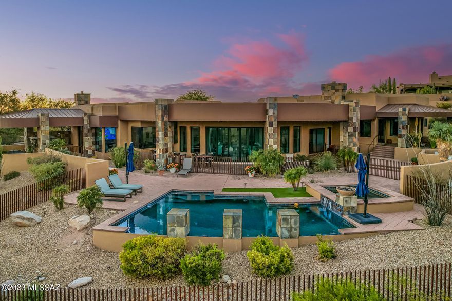 1+ acre 4757 SF grandeur home located in Coyote Ridge Subdivision with a perfect floorplan/layout. One of the best Panoramic city and mountain views throughout. Gated courtyard with fountain. Outdoor bar with 3 beer taps & TVs. Floor to ceiling curved glass sliding door in living room with 24 ft radius, open floor plan, cherry wood flooring, Chef's kitchen with SS appliances, marble island with accent counters, bar seating, & butler's pantry with150 bottle wine refrig. Master bedroom includes large spa-like tub & built in Miele coffee maker. A must see home.