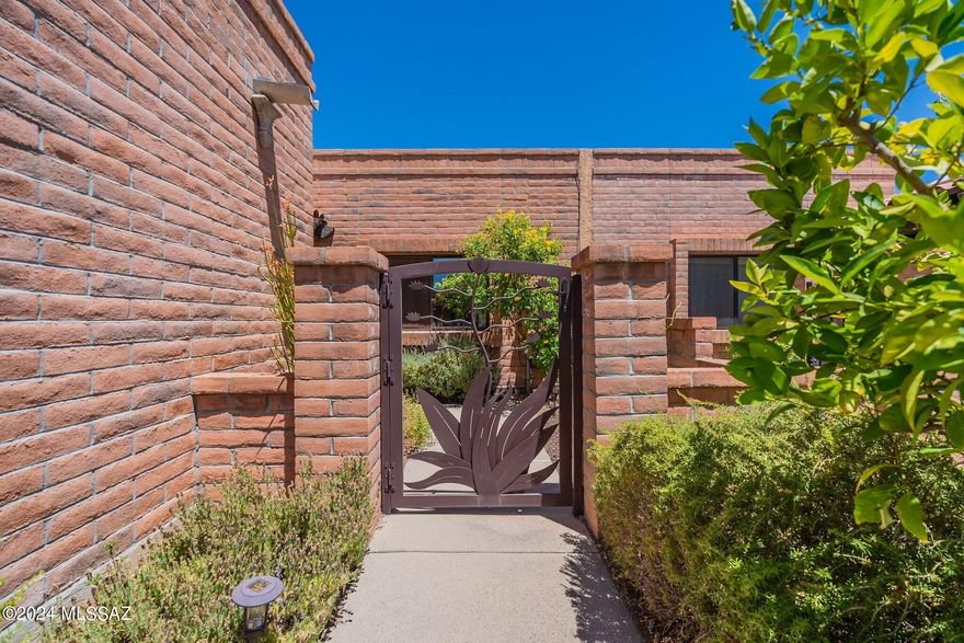 Nestled in the picturesque foothills of Tucson, this beautifully updated townhome blends modern amenities with southwestern charm. The bright, open kitchen/living space features new appliances, new quartz counter-tops & large island, new soft-close cabinets, and a fireplace. Spacious primary bedroom with a walk-in closet. Both bathrooms fully remodeled. The covered patio extends the living space outdoors. Enjoy the beautiful community pool and pickelball/tennis courts. You will fall in love with the Fairfield in the Foothills community.  New hvac 2021.