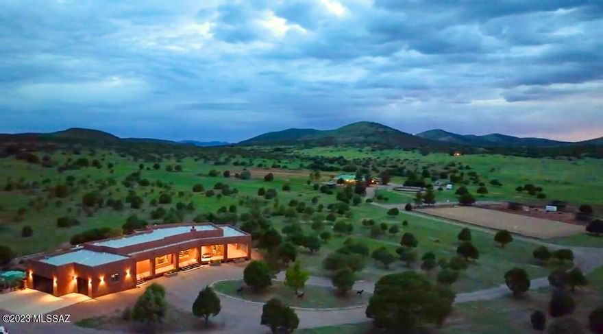 Truly the most remarkable custom built home, guest home and equestrian property. The property boarders Coronado National Forest on five sides, including private gate to access the National Forest for miles of riding enjoyment. The home was built with extreme thought in the design and nothing spared in the quality fixtures, solid wood doors and dual pane Anderson windows. The views are breathtaking from all the windows. A home truly built for the most meticulous. Superlative Equestrian facilities, 4 box stalls with pipe outdoor runs, all metal fencing, tack room, two separate accessory hay barns. Round pen, large arena, 5 paddocks, two pipe catch pens, and the entire 22 acres fully fenced. Additionally, there is a 40 foot sheltered roofed dog run with dog access door to go in and out