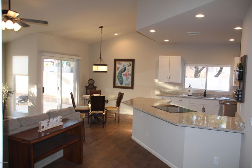 Back on market due to Buyer financing falling through. Beautifully remodeled 3 bed/2bath home in a highly desireable community. All new kitchen cabinets, granite countertops, stainless steel appliances, ceramic tile flooring throughout main areas & new carpet in bedrooms. Freshly tiled bathroom shower surrounds, new vanities, lighting and hardware. Mature, easy care landscape with citrus trees, and care free grass turf in the back for added color. This home has copper pipes. No poly. Low HOA fees include tons of amazing amenities. Meticulously maintained community pool, spa, tennis courts, basketball, sand volleyball, and Ramada facilities. One year home warranty included. Owner/Agent/Licensed General Contractor.