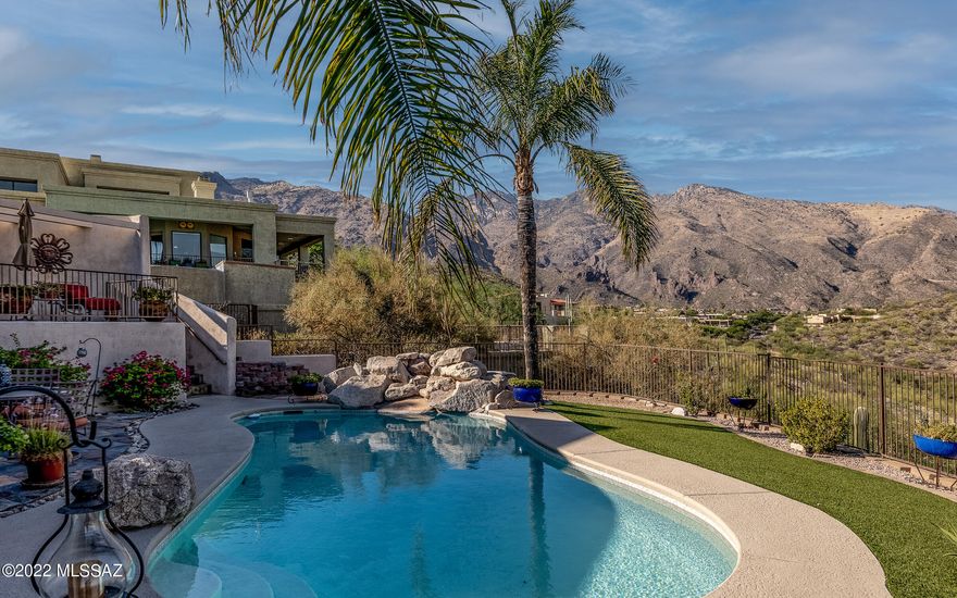 Enjoy some of the most dramatic & unobstructed mountain, sparkling city lights & colorful sunset views from this private custom home in highly sought-after Alta Vista. Grand foyer & incredible high ceilings will impress. An abundance of large windows cleverly allow the incredible views to be taken in from your living spaces.  Dedicated dining & family rooms add additional space for your guests. Open kitchen features upgraded appliances, oversized granite island w/gas cooktop, walk-in pantry & casual dining space. Primary suite includes an upgraded bathroom, generous closet & private balcony. Backyard oasis borders a secluded saguaro filled arroyo & offers many patios & outdoor living spaces designed for year round entertaining. 
Spacious 3 car garage with storage. Added bonuses include: New roof, newer AC & water heaters.