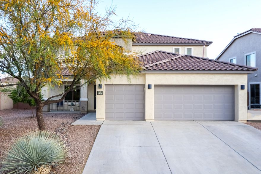 Resort Living in your very own backyard! Located in the beautiful community of Rancho Sahuarita. This gem features 5 bedrooms, 3.5 bathrooms, and a three car garage. Upstairs, you will find four bedrooms, two full baths, and a super loft that overlooks the backyard paradise. The master bedroom and laundry room are thoughtfully tucked away on the spacious first floor, where you will also be welcomed  with a formal  living room/dinning area, family room, and an adjacent kitchen that features stainless steel appliances and a large island with extra cabinet storage. Step outside to find a beautifully landscaped backyard that backs to natural desert and comes complete with a built-in grill, fire-pit, and a self-cleaning pool that has a beautiful rock water feature that flows through the slide and over the jetted grotto.As an added bonus this home has solar panels that provides year round energy savings, especially during those hot summer months!