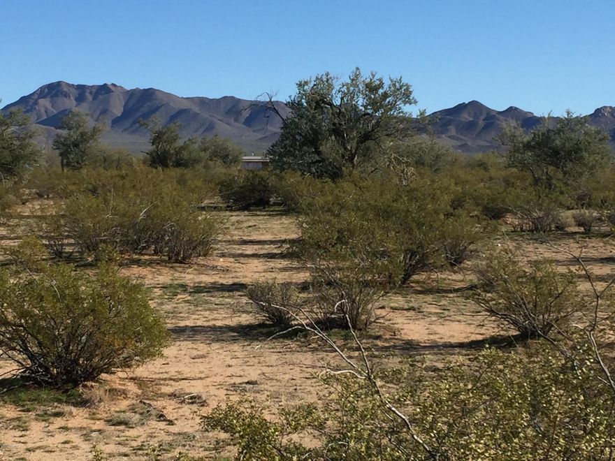 Flat 19+ac lot on county paved streets with the ability to be subdivided. Zoned GR-1 with multiple uses including: limited commercial use, agriculture, site build or mobile home residential and equestrian. Electric, phone and cable to lot line and gas and water in street. Quiet neighborhood with views of the Tucson Mountains. Easy access to I-10 and shopping. Sign is on NW corner of lot.