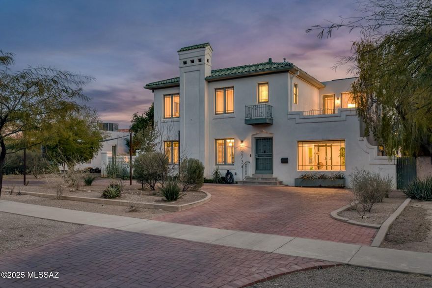 Stunning Sam Hughes Spanish Mission Revival w/ oak & mahogany hardwood floors under soaring beamed & plank ceilings, featuring natural light-filled formal living & dining rooms w/ adjoining patio. Arizona room, Butler's pantry, updated kitchen w/ extensive custom white Shaker cabinetry, quartz countertops, SS appliances, breakfast bar seating, open to fantastic family room w/ glass door leading to backyard patios. Bonus studio w/ ensuite bath. Primary suite features lofted coved ceiling, charming fireplace & beautifully remodeled bath. Guest bedrooms all enjoy lovely remodeled ensuite baths. Rear yard retreat includes pool w/ shade sails, EZ care turf, fruit trees, custom iron planters, outdoor living room & extensive hardscape, owned solar. Fabulous location near UofA, Himmel Park!