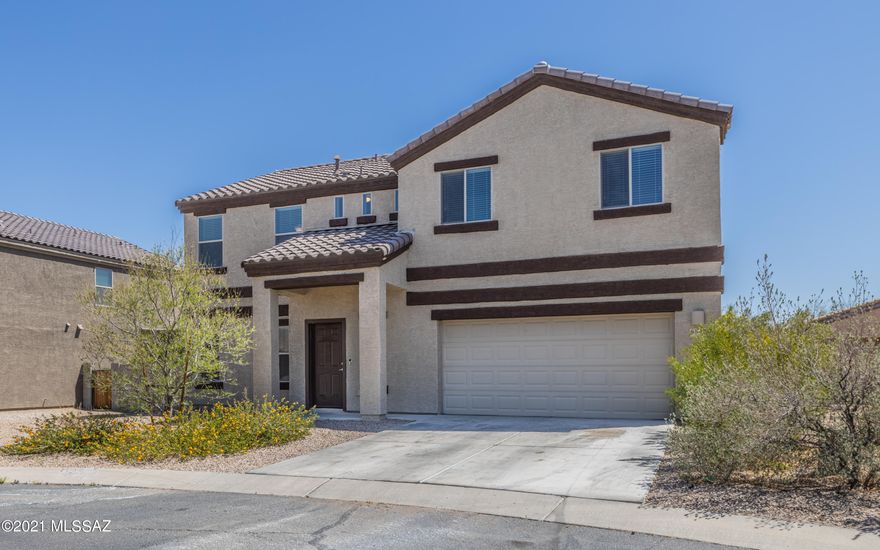 JAW DROPPING AHEAD! This home is in the Vail Dist., in a gated community, w/a pool, spa, park, basketball crt, playground, & rec center!  Minutes from all of this, is the home, towering w/a long driveway & plenty of elbow room from neighbors. The floor plan is very open w/tall ceilings & a roomy living space that opens directly into the kitchen. The island is unbelievably large.  You'll have plenty of room to prep, cook, store & entertain. The pantry is equally impressive & there is a downstairs powder room.  Upstairs you will be greeted w/a huge loft, providing another living space.  All appliances pictured stay, including the washer & dryer. The owners suite is huge w/a large bath & walk-in closet.  Enjoy dual sink vanity & walk-in shower. Window coverings & fans convey! WATCH VIDEO!!
