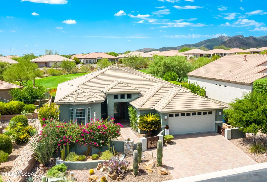 Exquisite highly upgraded Santa Rosa model located at the 1st green of The Highlands golf course. Lovely mountain & sunset views. Beautiful curb appeal-gorgeously landscaped front yard & courtyard. Backyard oasis w/multiple patio & relaxation areas. Luxurious amenities include African slate floors throughout (NO carpet), custom mahogany w/leaded glass entry door, custom fireplace w/mesquite & turquoise inlayed mantle, dry bar in great room. A true gourmet kitchen w/beautiful slab granite countertops & a very customized pantry closet. There is a built in desk system in den/office, Both bathrooms have custom walk-in tile showers & are beautifully upgraded. Whole house H2O filtration system added in 2021 ($3K). HVAC roughly 4 years old w/new remote control thermostat. Golf cart garage, too!