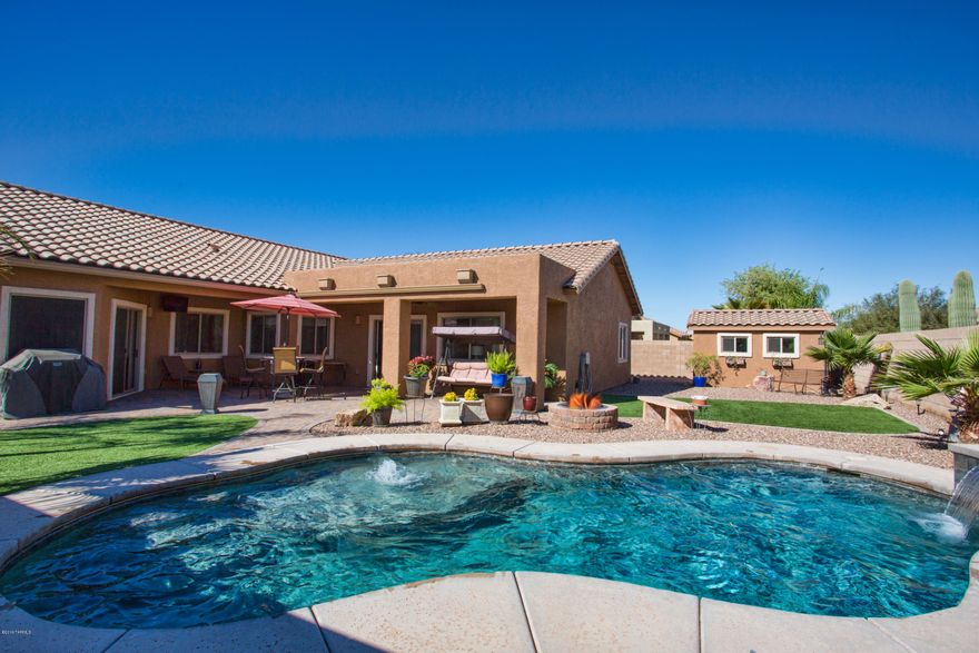 This amazing home feels like you just entered a model. You won't believe your eyes. Stunning 4 BR split plan w/formal living & dining, large family room, breakfast bar & nook too. Resort-like backyard w/pebble sheen pool, water feature, in-floor cleaning & DE filter. 3 car garage w/protective flooring & cabinets is a dream. Not to mention the 10x14 shed for all your goodies. This home was upgraded & improved for a forever home. Now there's an out of state move so YOU will be the winner! Recent/newer improvements include exterior & interior paint, carpet, pool, a/c unit, rain gutters, solar screens, shed, garage flooring & cabinets, Frigidaire Gallery kitchen appliances, dual side gate, faux grass - WOW!! Move in, unpack...you're ready to have your house-warming pool party.