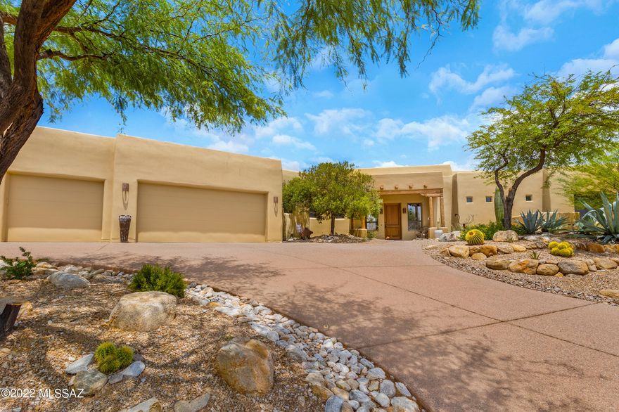 Range Pricing. Seller to consider/counter offers $850,000-$900,000. Exquisite Southwestern style custom home nestled on a high, almost one acre lot. Located in a private gated community, this home has stunning views of mountains, city and sunsets. The Catalina Mountains are the backdrop to every room through large picture windows! Quality abounds with wood beam high ceilings, Mexican tile, Saguaro rib accents, modern gourmet kitchen with granite countertops, soft close cabinetry, walk-in pantry, gas stove, under sink water filter, eating bar and dining area. The split plan offers privacy for guests. Second guest bedroom with private entrance, can easily serve as an office. Main bedroom suite, wood  plank ceramic tile, walk-in closet; double executive height vanities, separate walk- shower with dual showerheads, all with a bathroom gas fireplace for those cold winter mornings. The oasis style, private backyard has a vacation feel, with expansive covered patio, built in BBQ, gas fireplace, Pebble Tech self-cleaning  pool surrounded by extended paver patio area, perfect for entertaining. Easy cleaning with central vac system. Meticulous landscaping front and back with luscious fruit trees. The 3-car garage has it all: cooled with its own evap cooling system, one extended height/length bay,  work bench, overhead storage and utility sink. 3 built in safes, security rolling shutters and alarm system for peace of mind. Zoned AC system, water softener, recirculating hot water heater. This home truly has it all! See Special Features under Doc Tab.