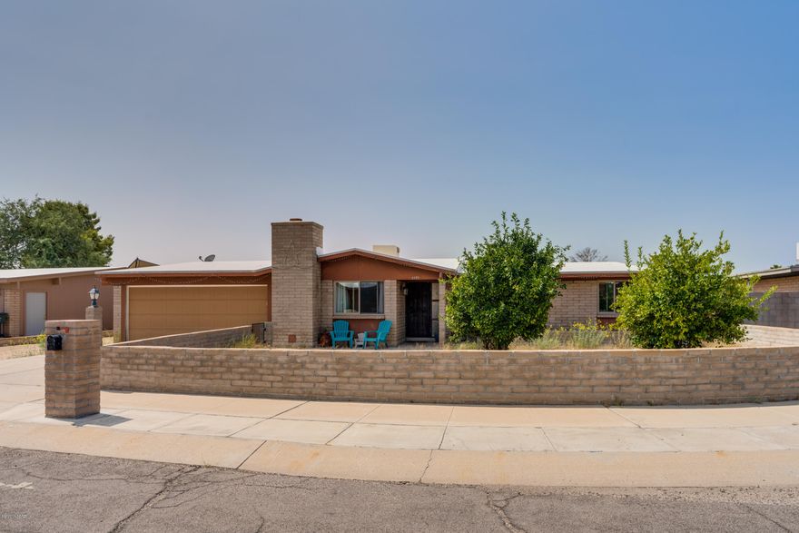 Fix up with lots of potential/cash only! This 3 bedroom, 2 bathroom home has brand new dual pane windows and ceramic tile flooring throughout. Updates include hall bath with tiled surround at tub, new ceiling fans and light fixture in kitchen, along with a solar tube that allows in natural light. Additional cabinets in dining area allow for more storage. Enjoy the fireplace on cold nights located in the great room. 2-car garage with additional side entry door. Located on .19 of an acre with multiple storage sheds in rear yard plus lemon, orange and grapefruit trees. AS IS sale, seller will make no repairs.A/C is not operable and evap cooling is currently being used.