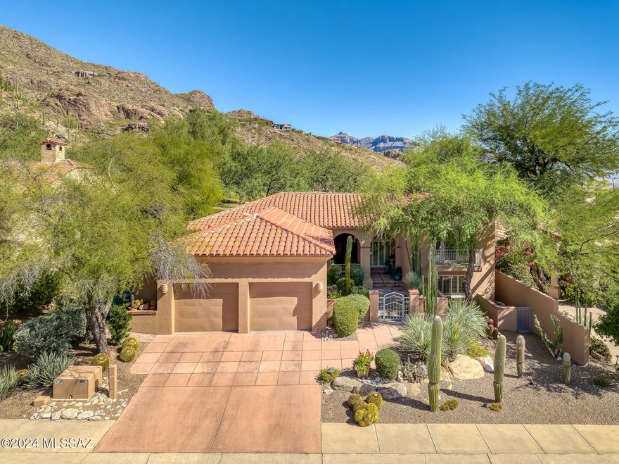 Elegance Exudes in This Updated 3BR & 3BA + Office Golf Course Home in Coveted Ventana Canyon. This Masonry Constructed Tri-Level Home on The 2nd Fairway of the VC Mountain Course Offers: Courtyard Entry - Formal Living & Dining Areas w/Fireplace & New Wood Floors - Luxuriously Updated Island Kitchen w/Stainless Appliances, Gas Range, Bar w/ Wine Fridge and Sink,Stylish Dining Booth all Opening to Great Room w/Custom Entertainment Built In's - Separate Office w/Built In's - Upper level Primary Suite w/ Spacious Bath & Two Closets - Lower Level Guest Rooms - Private Covered Patio & Outdoor Living Area w/ Grill, Fireplace, Automatic Shade Screens, Sparkling Spa w/ Waterfall, and Panoramic Golf Course and Mountain Views! 2022/23 - New Roof,Plumbing,Paint & Wood Floors-2021 HVAC'
