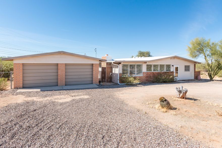 Great opportunity to live on over an acre of land in the heart of Oro Valley that is close to shopping, dining. recreation and more! Mountain and sunset views, wonderful natural light, cul de sac lot, quiet neighborhood, nicely upgraded home with solar heated pool. Bonus Arizona room offers sunset views and privacy. Large garage with built in cabinets. This solid brick home, with it's nice floor plan, ceiling fans,quartz kitchen cabinets, won't last! Call agent for a personal tour.