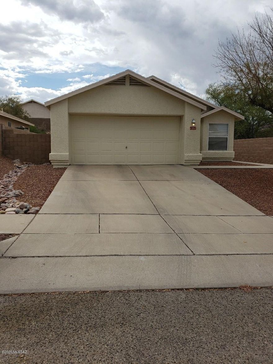 Tasteful, well cared for home. Master bath with upgraded tile surround, ceramic tiles throughout. Freshly painted exterior and well maintained fascia. Quiet, friendly neighborhood close to U of A, Pima Community College West,  and I-10. The photos supplied by the owner do not do this home justice. This beautiful home will not last!