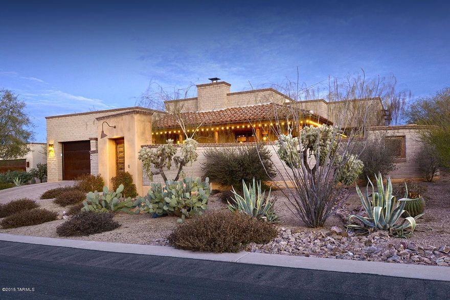 CLASSIC ARCHITECTURE MIXES WITH AN ELEGANTLY CASUAL SPACE CUSTOM TAILORED FOR THOSE SEEKING THE DESERT LIFESTYLE. ENTER THROUGH A 2-FOOT THICK, ANTIQUE GATED BUTTRESS, ONTO THE PRIVATE COURTYARD WITH FIREPLACE & CATALINA MTN VIEWS. INTERIORS INSPIRED FROM REGIONAL DESIGN & COMPLEMENTRAY ELEMENTS, SUCH AS KNOTTY ALDER CABINETRY & 1 3/4'' DOORS, POLISHED CONCRETE FLRS & COUNTERS, GOURMET KITCHEN WITH FULL VIKING APPLS PACKAGE, CUSTOM STEEL CASEMENT EXTERIOR DOORS, ROUGH-SAW WOOD & VIGA BEAMED CEILINGS, SET AGAINST A NEUTRAL COLOR PALETTE, ADDING LAYERS OF TEXTURE THAT REFLECT THE NATURAL SURROUNDINGS. THE REAR COVERED VERANDA, WITH BUILT IN BBQ, AS WELL AS WOOD BURNING GRILL, OVERLOOK THE POOL & COVERED OUTDOOR DINING AREA, EMPHASIZING ENTERTAINMENT AS A KEY ELEMENT OF THE ARIZONA LIFESTYLE.