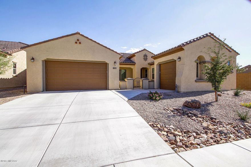 Beautiful Landscaped Backyard with Travertine patio flooring and an Extended Travertine stone patio area.  Backyard boost Trees and shrubs with Mountain Views.  Top Quality Screens installed that includes a remote control.  Walk in to a grand foyer with vaulted ceilings and custom design features through out this beautiful home.  Like New Pulte Home built in 2016. 3 Bedroom/3 Bath Plus Den.  Open Floor Plan w/Large Great Room, Lots of Windows to enjoy the outdoors.  Gourmet Kitchen features a large Granite Island, Walk-in Pantry, Double Ovens, 5 Burner Gas Range, Espresso Cabinets, Stone Tile Backsplash. 18'' Porcelain Floor Tile with upgraded carpet in bedrooms.  Master Bathroom has Extra Large floor to ceiling tiled shower w/ bench, Separate Granite vanities and large walk in closet.