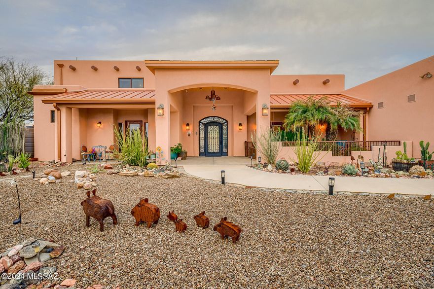This residence stands as a true architectural  masterpiece!! Showcasing unobstructed mountain views from almost every rm. Contemporary interiors w/natural accents & art seamlessly embedded into the walls. Wheelchair accessible. Family rm w/dramatic 20 ft ceilings, polished concrete floors, gourmet kitchen, top of the line appliances, pantry & wet bars. Lux bath, jacuzzi tub & a generous master bedroom. Each room is a suite w/their own bath & patio. Oversized 3 car garage & a balcony overlooking the stunning Catalina mountains. Enclosed yard w/ramada, spa &play area. This home is a sanctuary of tranquility sitting on nearly 5 ac. of majestic saguaro land!  You'll find yourself in an isolated desert pocket w/an extremely unique peaceful solitude. Near finest amenities & restaurants & No HOA