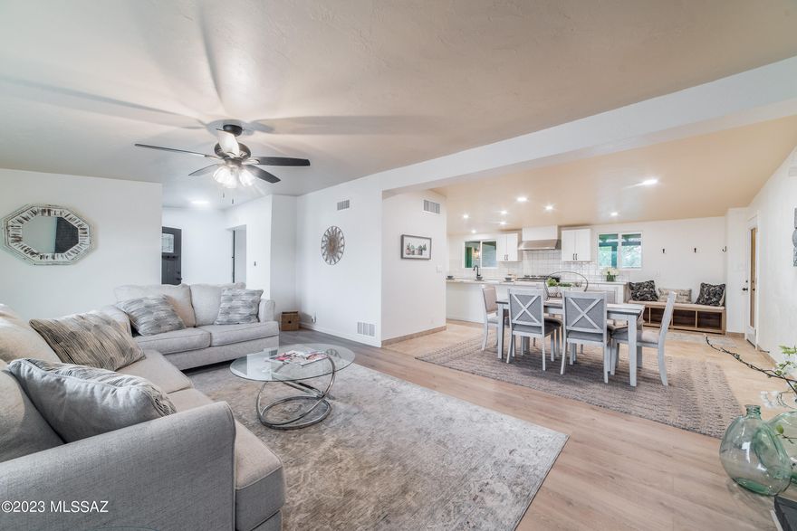 Beautiful remodeled single level home in Casas Adobes Estates. Great location with shops, grocery, and restaurants nearby. All new kitchen with large walk-in pantry and quartz counters. 36'' chef's range and hood. Large living room with fireplace off front entry. Sunken family room with 1/2 bath off kitchen. Four bedrooms + den with sliding glass barn door. New baths with all new tile, cabinets, and light and plumbing fixtures.  All new dual pane windows and exterior doors. Two HVAC units (one brand new and the other two years old). Front yard has large, gated private courtyard with lighted walkway to entry. Backyard has gated pool and two large grassy areas.  EZ conversion to drip sprinklers if grass not wanted. Big lot with plenty of space for extra toys with no HOA. Seller is owner/agen