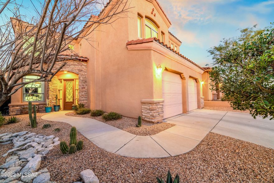 Soaring cathedral ceilings, wonderful floor plan  & abundant natural light welcome you, & a clever conversion of the loft into an enclosed home office/den with a stunning reclaimed wood barn door makes this one an extra special find!  Now the home features BOTH an exercise room/den AND a home office/den, a dramatic art wall! Large bedrooms. formal dining PLUS breakfast nook PLUS bar seating make this perfect for a family or an entertainer. Step out the north-facing glass doors to an outdoor living room tucked under a deep, shady porch, built in BBQ with extensive flagstone patio surround, sparkling pool w/rock waterfall feature and a spa for luxuriating under the stars. Beautiful kitchen features ss appliances, granite counter & abundant wood cabinetry, nestled in gated/guarded La Paloma!