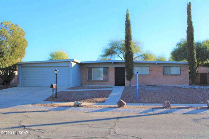 Classic brick home ready for immediate new owners! New carpet in bedrooms/living room. Tile everywhere else! Fresh interior paint. Granite counters in kitchen & bathrooms. Family room off kitchen has wood burning fireplace with access to covered back patio and yard with pool /firepit!  Spacious laundry room/pantry off kitchen has access to side yard and garage. Kitchen has newer wall oven and dishwasher (2 years), water heater is approx. 1 year old. Skylights in kitchen and hall bath, ceiling fans through-out. Rooms are prewired for surround sound, and have built-in speakers in ceilings.