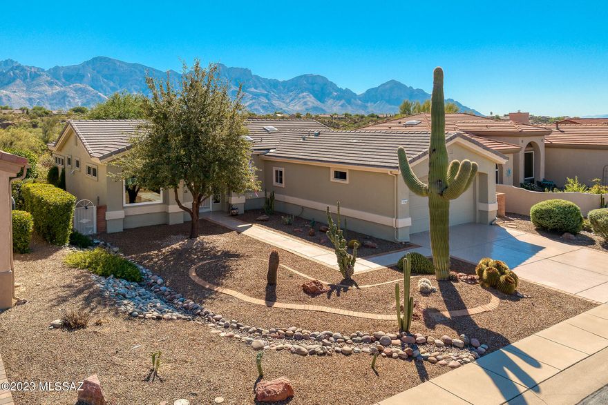 Incredible views from this renovated 2 bed, 2 bath plus den (1635 SqFt), Mayfair Model home located in Sun City Oro Valley. As you step inside, you'll immediately be greeted with large view windows showcasing the breathtaking Catalina Mountains. The kitchen is complete with stainless steel appliances, granite countertops, a breakfast bar and an open dining room. Indoor laundry room has ample storage and utility sink. Some of the newer additions include tile flooring throughout the main living area, carpet in bedrooms, HVAC, windows & replaced roof. The true showstopper of this home is the panoramic Catalina Mountain views, visible from both inside the home and from the backyard.  Sun City Active Adult Community features a clubhouse, golf, fitness center, pool, library & more!