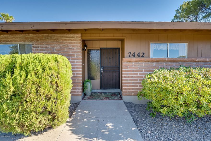 Beautifully remodeled home with spacious kitchen -ready for a farm table or even a second den area. New roof, A/C, flooring, cabinets and more. This home has lovely natural light, a view of the mountains from the living room window and a back yard that's great for entertaining or raising a family with its extended porch and patio areas. It has grass and a slab ready for a barbecue area, fire pit, play house or storage building. Patio Furniture and window coverings do not convey. Owner/Agent.