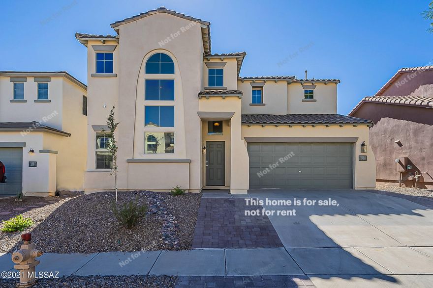 This Sahuarita two-story home offers quartz countertops, and a two-car garage.