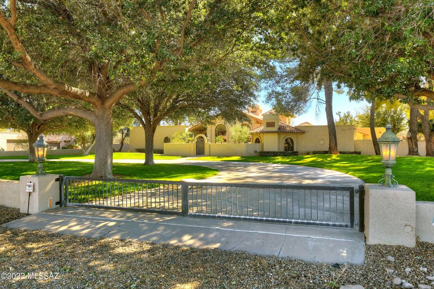 This stately, private, classic Tubac home features mature oak trees, lush lawns & courtyards.  Situated behind #5 Otero tee box of the Tubac Valley CC estates, this 5642 sq/ft, 4 BR, 4.5 BA features soaring cathedral wood beamed ceilings in the spacious combined living/dining area, master BR w/adjacent sitting area & fireplace & split MBath.  Fabulous kitchen w/side by side Subzero refrigerators, dual Thermador ovens, Decor gas cooktop & microwave and oversized island w/granite tops. Full baths in guest bedrooms.  Spacious den/office & enclosed ''Arizona'' room w/oversized windows adjoins the impeccable rear walled yard and patio areas w/mature landscapes. Private well.  Includes adjoining (.56 acre) lot, parcel 112-06-002D, to the South of the property (1.36 acres total).