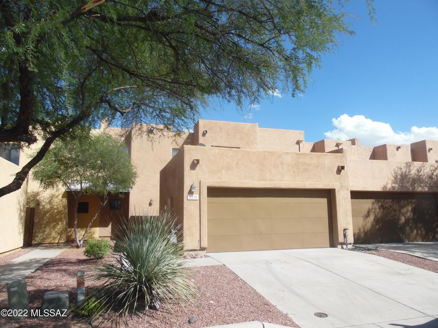 Move right into this very spacious 2 story townhome. This home has it all.  Very nice open floorplan, 2 car garage, master bedroom on the bottom floor, 2.5 baths, study nooks, enclosed backyard, 3 total bedrooms, washer dryer hookups and has just been freshly painted.  Home is close to Banner, the U of A, shopping, restaurants and entertainment.  Call today!