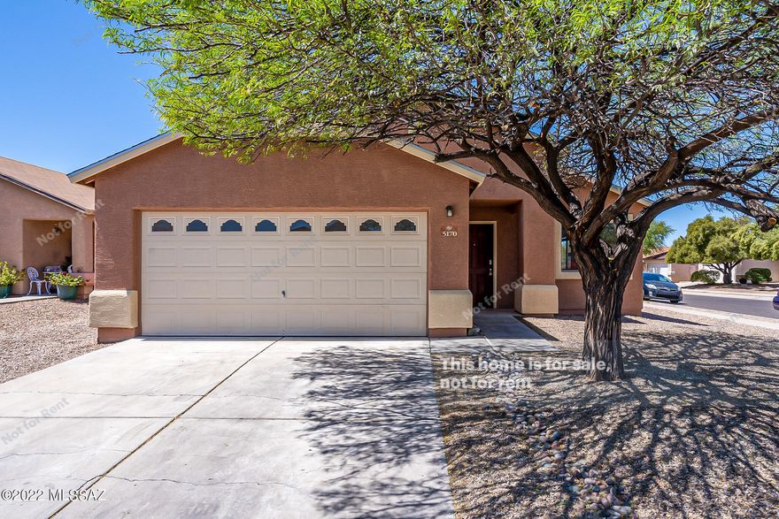 This Tucson one-story home offers a patio, and a two-car garage.