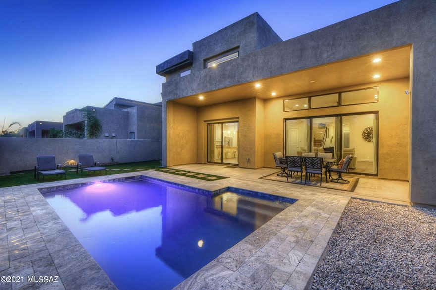 Modern luxury meets history and charm. Welcome to 3040 Sam Hughes Court, a newly constructed, energy efficient, iPad controlled smart home in the famously historic Sam Hughes neighborhood, ideally located in a gated enclave in the heart of Tucson. This thoughtful floorplan includes one bedroom and bath downstairs with three bedrooms and two baths upstairs. The owner's suite includes two walk-in closets and a spa-like en suite bath. The upstairs loft is an ideal second living space and provides access to the balcony, which features expansive mountain views. The great room and kitchen offer plenty of space, with high ceilings, natural light and access to the expansive covered patio and new, heated pool, which is surrounded by lush, inviting turf. This is the lifestyle you deserve.
