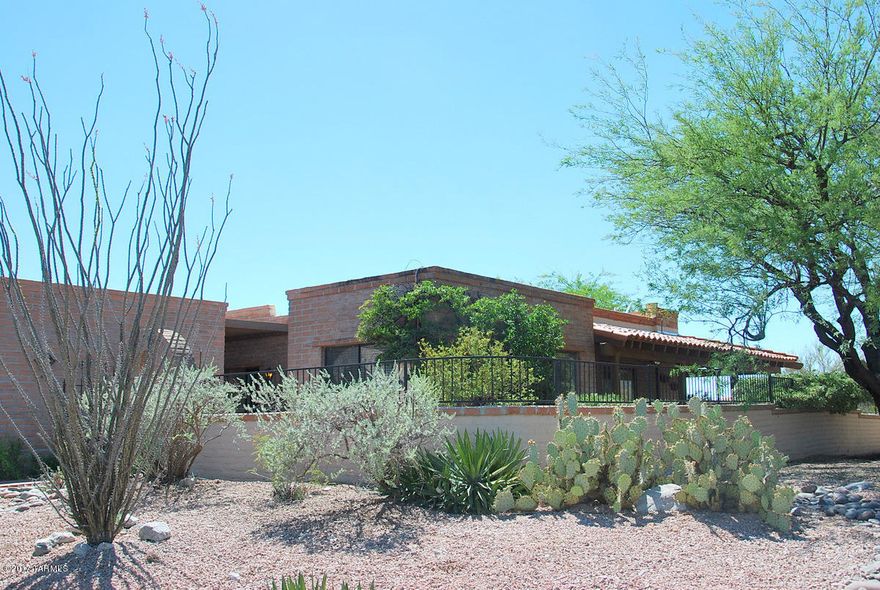 Delightfully sited with mountain views and a common area on the Northside of this townhome. All freshly painted. Handsome Plantation Shutters in great room. Open floor plan offers a breakfast area/den off the kitchen. Master-suite has been expanded to create a sitting area. Bedroom two has also been expanded to create an office area. See the stunning views of the Rincons while prepping meals. Enjoy the sunset views of the Catalinas. Lots of SW ambiance created by the Saltillo tile floors, beehive fireplace and Talavera tiles in the bathrooms. Lots of mature landscaping including specimen cacti and butterfly friendly plants. Community offers pool, spa, tennis, and jogging trails. Convenient to all the amenities the foothills has to offer.