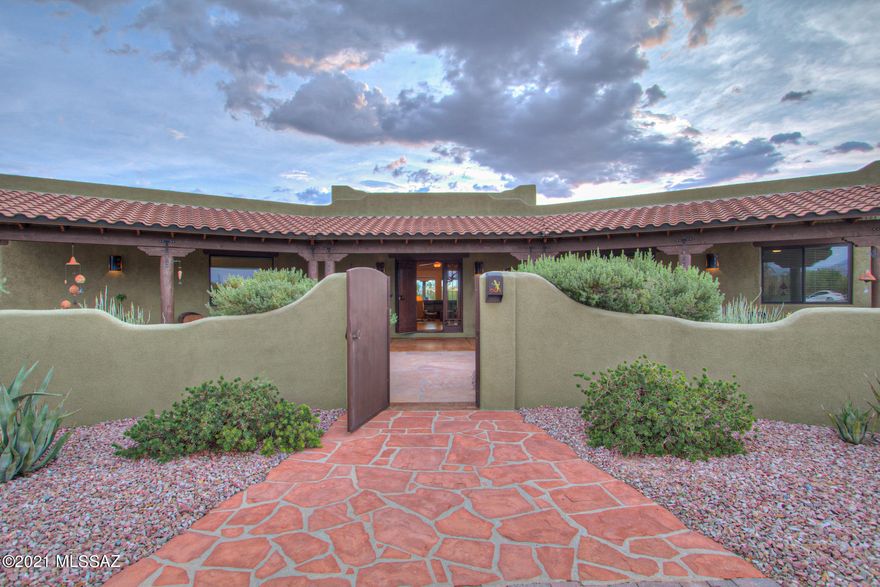 This Northwest treasure brings 3.31 acres of tranquil desert to life with a magnificent southwest  masonry block custom home. You'll know it is one of a kind as soon as you pull into the driveway, greeted by the desert's natural beauty and entry courtyard.  You'll find there is no lack of space here, both inside and out. The massive great room boasts raised wood ceilings and is open to the spacious kitchen and dining area. Master suite is unforgettable with a romantic beehive fireplace, large walk-in closet, and a tub with a view.  Larger bedrooms w/ walk in closets, a media room, and an office; all of this comes with a highly desired 3 car garage. This horse property has been meticulously maintained and offers you a clean slate to make it all your own, with a $25,000 yard allowance at closing. Call it home, today!