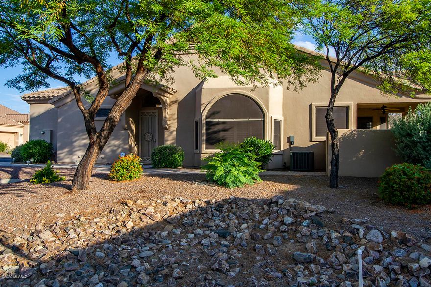 Exceptional 1593 sq. ft. Chula Vista Model, 2 Bd/ 2 Ba/ Den/, Catalina Mountain views, privac Guest parking. Extended patio w/water fountain, built in BBQ. fenced in backyard. 2018 AC/heater unit, 4 new ceiling fans, 2 new light fixtures, new carpet in both bedrooms. Gas fireplace. New appliances in kitchen and new washer/dryer. Remodeled master bathroom - new shower - new 36'' height vanity with sink. Bay windows in both bedrooms and kitchen area and great room with Shutters on all of the windows except for the sliding glass door. 28' x 78'' cabinets in garage, 10' x 40'' high work area in garage. Age restricted GATED community with 2 salt water pools and spa, Club house w/kitchen,  with work out room, billiard and card room, library. HOA includes water, trash,sewer,basic cable, exterior pest and termite control, roof maintenance & exterior painting of townhouse. Adjoining Hohokum park w/tennis, dog run, grilling facilities, and grass.