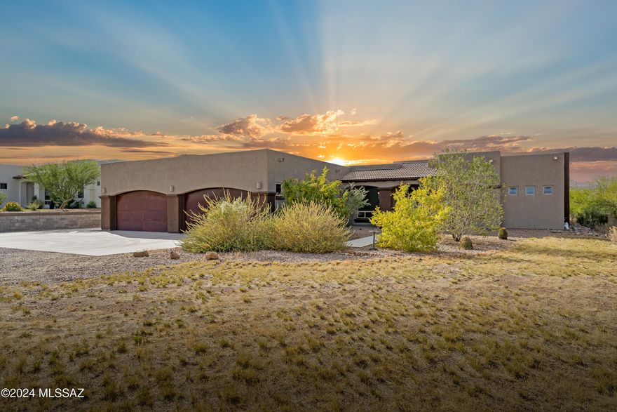 Discover your perfect sanctuary in this captivating 4-bedroom, 3-bathroom custom-built home,  complete with an impressive 8-car garage and a workshop designed for enthusiasts. Nestled on a  spacious acre lot with no HOA, this property offers unparalleled freedom and stunning views that will take your breath away. As you enter inside, you'll be greeted by a thoughtfully designed split floor plan that effortlessly combines style and functionality. The open concept living space invites natural light to flow throughout, creating an inviting atmosphere ideal for gatherings with family and friends. The gourmet kitchen is a chef's dream, featuring a large granite island and high-end appliances that make cooking a delight. The primary bedroom is a true retreat, generously sized 
and adorned with a walk-in closet. Pamper yourself in the luxurious ensuite, complete with a contemporary shower and a relaxing tub. For those who cherish hobbies or need ample storage, the 8-car garage with an air-conditioned workshop is a standout feature. The expansive lot also includes an RV pad, making it perfect for adventure seekers and outdoor enthusiasts. With 10-foot ceilings throughout and an extended covered patio, this home seamlessly blends indoor and outdoor living, offering a serene space to unwind and enjoy the stunning surroundings. Don't miss your chance to own this remarkable property that embodies comfort, style, and breathtaking beauty. Schedule your viewing today and envision your life in this extraordinary home!