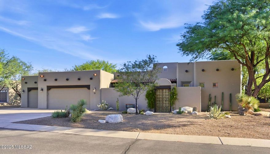 Enter this lovely home through the unique round foyer into a bright, airy, open Hacienda model floor plan.  This well-maintained home has a total of 2,531 Sq. ft and features 2 bedrooms (one in the separate 405 sq. ft. casita) and 2 ½ baths.   This stylish home has one primary bedroom and  full bath, large den, open concept kitchen with updated stainless steel appliances, new tile back splash and quartz counters. 
This living room has a wood beamed ceiling and and a gas fireplace. The room opens to the front and rear patios for easy entertaining.
The casita which has its own private entrance for ease of use offers your guests comfortable accommodations with a bedroom and full bath. 
The front courtyard features a wood burning fireplace and fountain. While the rear covered patio overlooks a beautiful heated pool and spa surrounded by lush, mature desert plantings. 
Additional features include: three car garage, water softener, central vacuum system, and tiled flooring throughout the home. 
A stairway to the roof offers the potential for a roof deck, perfect for enjoying views of golden sunrises and sunsets or Arizona 's renowned star gazing.
Embrace the best of Southern Arizona lifestyle in a beautifully landscaped setting.