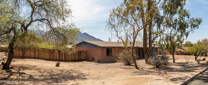 Breathtaking Views! Updated 3bed, 2 bath home situated on .82 usable acres. Slump block construction with dual pane windows, a large covered patio, and single car garage.
The kitchen has been remodeled and includes stylish cabinetry, granite counters and stainless steel appliances.
The fully fenced rear yard is gated so that you can park all of your toys. You will be able to enjoy the mountain views from the beautiful gazebo. Nearby amenities include parks, trails, golf, restaurants and shopping. Best of all, in the heart of Oro Valley with NO HOA! Listing agent is related to sellers.
