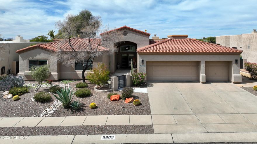 Simply stunning must see Contemporary home in Shadow View estates. Every aspect of this home has been renovated with exquisite taste & the finest of details. 4 bed 2.5 bath with den. Enter from the elegant front courtyard & foyer to the high ceilings & huge view windows of the living area. Tastefully installed ceramic tile. Beautiful custom built grey & white kitchen cabinets accented with smokey grey quartz countertops. This gorgeous space opens to a spacious family room with corner windows with views of the Tucson Mts. Enter your sweeping primary suite with sitting area & bath with extra wide walk-in shower, sleek cherry wood double sink vanity. Walk-in closet with all the options for organizing your wardrobe.  3 bay garage with EV port, zoned  HVAC with humidifiers, owned solar system. Electric remote controlled shades on large view windows. Kitchen cabinets have pull out drawers and soft close features. Wolf gas cooktop. Wall mounted oven and microwave. All lighting, fans, fixtures outlets and switches replaced in 2017. Both HVAC units replaced in 2017. Full house water filtration with salt free softener, electric outdoor solar shades on porch, rolling security shades on south and west side. Landscape lighting. Citrus trees- grapefruit & Oranges. The quality and exquisite design of this home is not often found. Come take a look before it is gone.