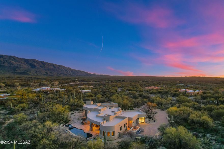 Majestic and breathtaking views of the Rincon mountains! Tranquility, nature and peace surround this architectural masterpiece located in the prestigious La Cebadilla Estates. Enter this stunning custom home through your own private gate. This warm and inviting home offers a unique and spacious open floorplan with many wonderful living spaces and 4 cozy fireplaces! 3BR,4BA 3,755 SF boasts Living room with a wall of windows, dining area, office and spacious primary suite. Every room has a gorgeous view! In the heart of the home is the entertainers dream kitchen that features granite counters, sit up bar, large island, wine fridge, breakfast nook, double oven and plenty of space for entertaining. Enjoy family gatherings in open great room. Your guests will love the 2BR/2BA private casita off the main home. Incredible outdoor living and resort style backyard! Backyard features include heated pool, spa, new BBQ grill, fireplace, multiple large, covered patios and extra fencing around the entire back yard, that keeps out desert critters.  Privacy and serenity abound, and the property is surrounded by saguaro cacti, and situated on 3.72 acres. 3 car garage with one of the bays repurposed as an art studio with a mini split system that can be used as a bonus room! This wonderful home has many new upgrades that include newly sealed roof; new grill; 11 new windows; one new HVAC; new BBQ grill; pool pump with remote; 3 new skylights in the primary suite and so much more! This lovely property is nestled up to the base of the Rincon mountains and is surrounded by hiking trails, horse trails and a private lake. See included features list. La Cebadilla  is considered a dark sky community. You really can have it all!