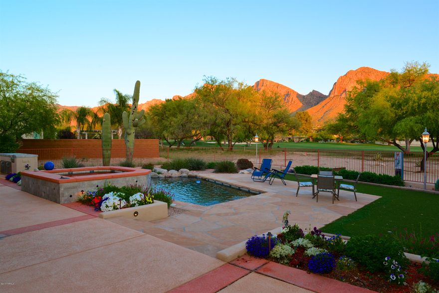 One-owner Custom Home built in 2004 on premium golf course lot offers Amazing backyard Pusch Ridge views! Featured in Tucson Lifestyle Magazine, this 2778sf 3BR/3BA gem has a classy courtyard entry w/charming patio.  Great room plan w/vaulted ceilings & doors/windows to capture golf & mountain views. Kitchen remodeled 2014 w/granite counters, SS appls & alder cabinets. Split floor plan w/private master suite, den(or 3rd BR) and 2 full baths on one side of home; full guest suite on the other. Impeccable backyard landscape design w/pebbletec pool & cascading spa, covered patios, outdoor kitchen & FP, putting green. Paver drive & oversized 3-car garage, private carts ok at OVCC. Perfect for those who want luxury desert living & a country club lifestyle. In the exclusive 3rd Fairway of OVCC.