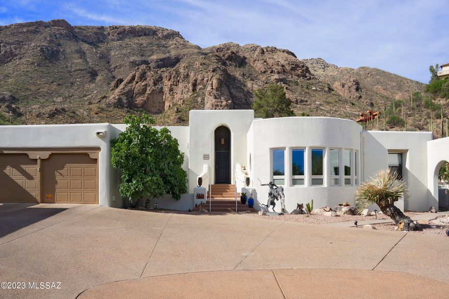 What a transformation!  Taking the good bones of a long neglected property and creating a tranquil home.  The character throughout - wood floors in a rustic. style, kiva fireplaces, expansive primary suite with office and updated bath (even plumbed for a tub), split floorplan.  Oasis pool area (also redone) with solar heat and those views!  The grilling station is every chef's dream and just off the remodeled kitchen (french doors added) for easy access.  The detached casita, just steps from the pool, perfect for guests, a studio or...