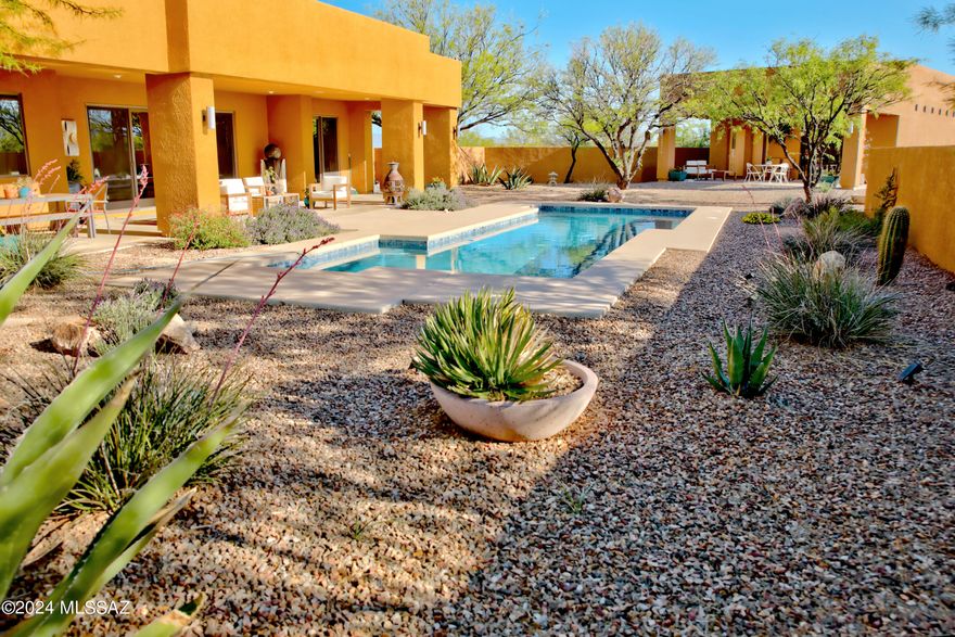 Here is a rare opportunity to own a Southwest contemporary style home in the prime gated community of Three Canyons Ranch. Custom built in 2005 by Walston Custom Homes, it is situated on a 14.73 acre corner lot just off a paved Three Canyons Road. With 2,325 square feet of thoughtfully designed living space in the main house, owned solar panel system, and an attached 2 car garage, this property offers more than most. A recently added 835 square foot detached, pool house with a ¾ bath, roll-up glass door, and an attached 2.5 car extended garage affords an area for hobbies, recreation, or guest quarters. The scenic backyard oasis features a stunning pool, exquisite landscaping, and awe-inspiring views. Too much to mention here. See Home Features, Upgrades & Amenities list in document tab.
