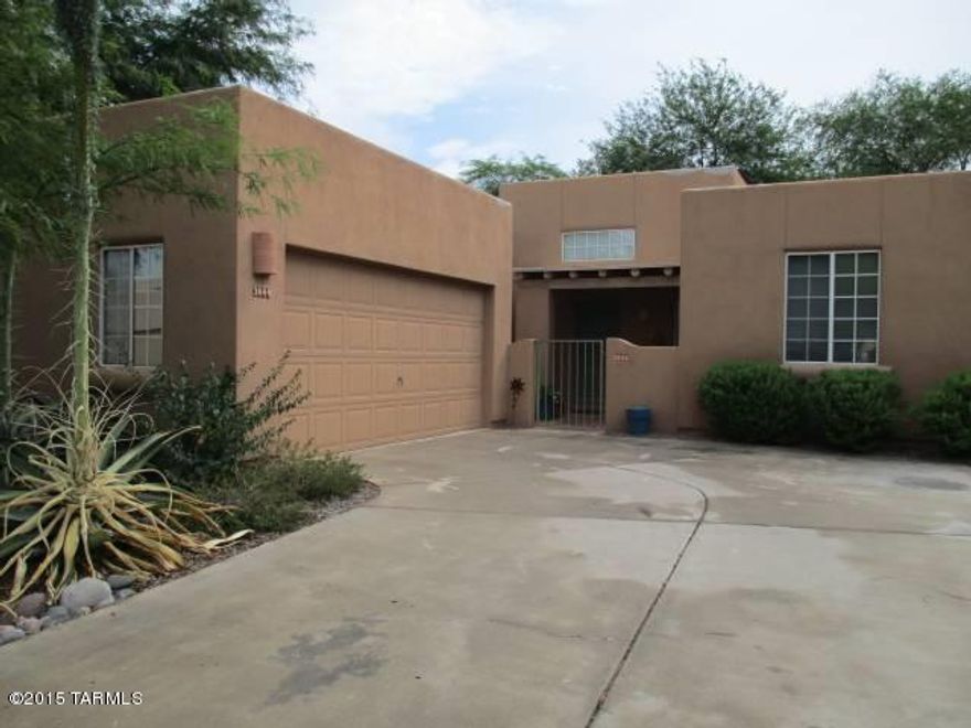 Adorable completely furnished free standing home in small upscale community.  Features include Saltillo tile/carpet, 2 bedrooms, 2 baths.  Formal living room with fireplace plus family room off kitchen.  Lovely mature flagstone patio with fireplace & BBQ.  Community pool directly across street.  Close to Ft. Lowell Park with shopping & restaurants only minutes away.