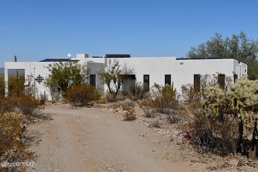 Ironwood Ranch, a diverse property of abundant natural beauty with native vegetation and mature saguaro. Located only a couple miles from I-10 and major shopping, this property offers opportunities for tranquil living, rental income, or investment potential. All improvements currently rented so showing can only be arranged with accepted purchase contract. property consists of 27+/- acres Suburban Ranch zoning (3.32 acre minimum lot size), 3000 SF custom 3 BR, 2BA home w/den & office, & 12' wrap around porch. Floors are tile (master is granite), high ceilings, extensive solar energy, dual cooling & so much more. AT this time, the home & 5 separate rental units are tenant occupied. The 2 greenhouses which are also leased. See additional documents for more info.