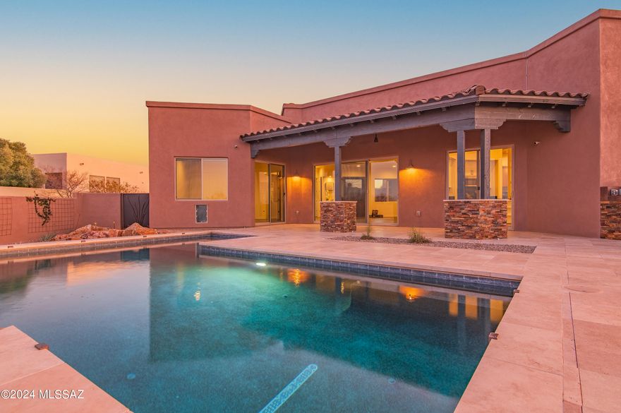 New Price! Make this Incredible Home Yours Just in Time for the Holidays!!!   Located in the prestigious Preserve at Sycamore Canyon gated community, with only 18 one-acre homesites.  This exceptional home nestled within the serene Sycamore Canyon community. This residence is a masterpiece of customized features added by the owner to be their forever home, exuding the elegance and luxury of a million-dollar custom home. Situated on a sprawling 1.08-acre lot, this property offers unparalleled privacy and breathtaking views of the Sonoran Desert. You are buying an acre but the green space and views make it seem like you are on a lot more!  As you approach the home, a grand sweeping driveway on a cul-de-sac lot leads you to a charming courtyard entry with fountain. Notice the exquisite custom iron door art and the inviting extra-wide Walnut front door. Upon entering, you are greeted by soaring ceilings, exquisite tile flooring, and a captivating modern gas fireplace. The gourmet kitchen is a culinary enthusiast's dream and the backyard is your private resort, including a travertine patio, beautiful pool with rock waterfall, built-in natural gas bbq, mister system and basalt water fountain.  Orange trees and flowering plants await you!  HOA fees cover gated community, Sycamore Canyon private park and pool, private trails, and trash pickup.  You will fall in love with this property!