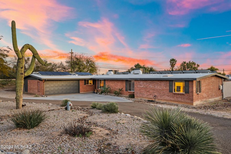 Spectacular upgraded 5BD/3BA (2,775 sq ft) home on over 3/4 acre in Northwest Tucson w/ mountain views, new sparkling pool, play area & NO HOA!  Arrive through circular drive & stroll through the attractive foyer into the large gathering room w/ knotty pine ceilings, gas FP, & spacious dining area w/ coffee bar. Kitchen has all newer SS appliances, gas cooktop, island with breakfast bar & nook. Oversized primary bedroom w/ gorgeous ensuite bath, walk-in closet, & direct access to back patio. 2nd bedroom w/ ensuite bath also has walk-in closet & direct access to patio. Backyard is an entertainers dream w/ 2 large outdoor entertainment areas, new built-in BBQ & area for dogs. Relax under the pergola or soak in the new pebble sheen pool w/ Lagoon. Too many upgrades to mention! A Must see.