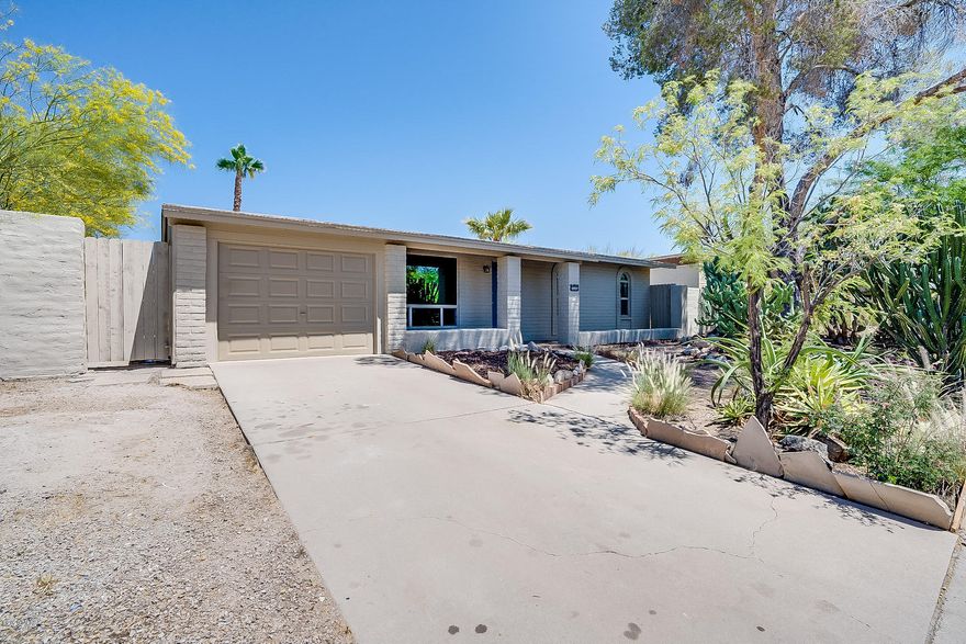 Perfection! This tastefully remodeled northwest home has been completely updated for a modern lifestyle. Attention to detail is at the heart of this home. As you enter the home, you will be enchanted by the atmosphere that is flooded with natural light, fresh paint, easy care Concrete flooring with new baseboard throughout, no immediate neighbor behind and mountain views. The gorgeous kitchen boasts new all-wood, soft close cabinets, quartz counters and stainless-steel appliances. Both Bathrooms are beautifully remodeled. New A/C, new dual pane windows, new roof singles and LED recessed lighting are some of the other updates. This tastefully remodeled home has two living areas! Entertain under the covered patio and enjoy the sparkling pool in you huge walled-in back yard. The large laundry room has plenty of space for storage. No HOA! Great location, convenient to shopping, hospital and I-10. This home has a ton of charm, and is sure to wow you when you walk through. 3D Virtual tour of this home is available under photos. (https://my.matterport.com/show/?m=3WTv5SRAPW7&mls=1)