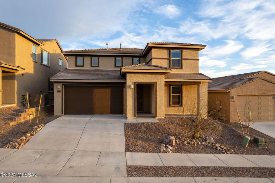 Seller's Loss is YOUR GAIN!!! Lived in less than a month, like NEW Meritage energy-efficient home BELOW APPRAISAL, WITH LOW DOWN, BELOW MARKET INTEREST ASSUMABLE FHA LOAN - offers 4 bedrooms, 2.5 bathrooms PLUS SEPARATE OFFICE AND LOFT!! Gourmet kitchen has loads of cabinets, walk in pantry, stainless appliances, gas cooktop and wall oven and microwave, breakfast bar & gorgeous granite counter tops. Located off of I-10 with easy access to downtown Tucson, the community of Rancho del Lago is just minutes from nearby shopping, dining, open space, and employment centers and has its own golf course! Known for their energy-efficient features, Meritage homes boast a healthier and quieter lifestyle while saving you thousands on your utility bills.